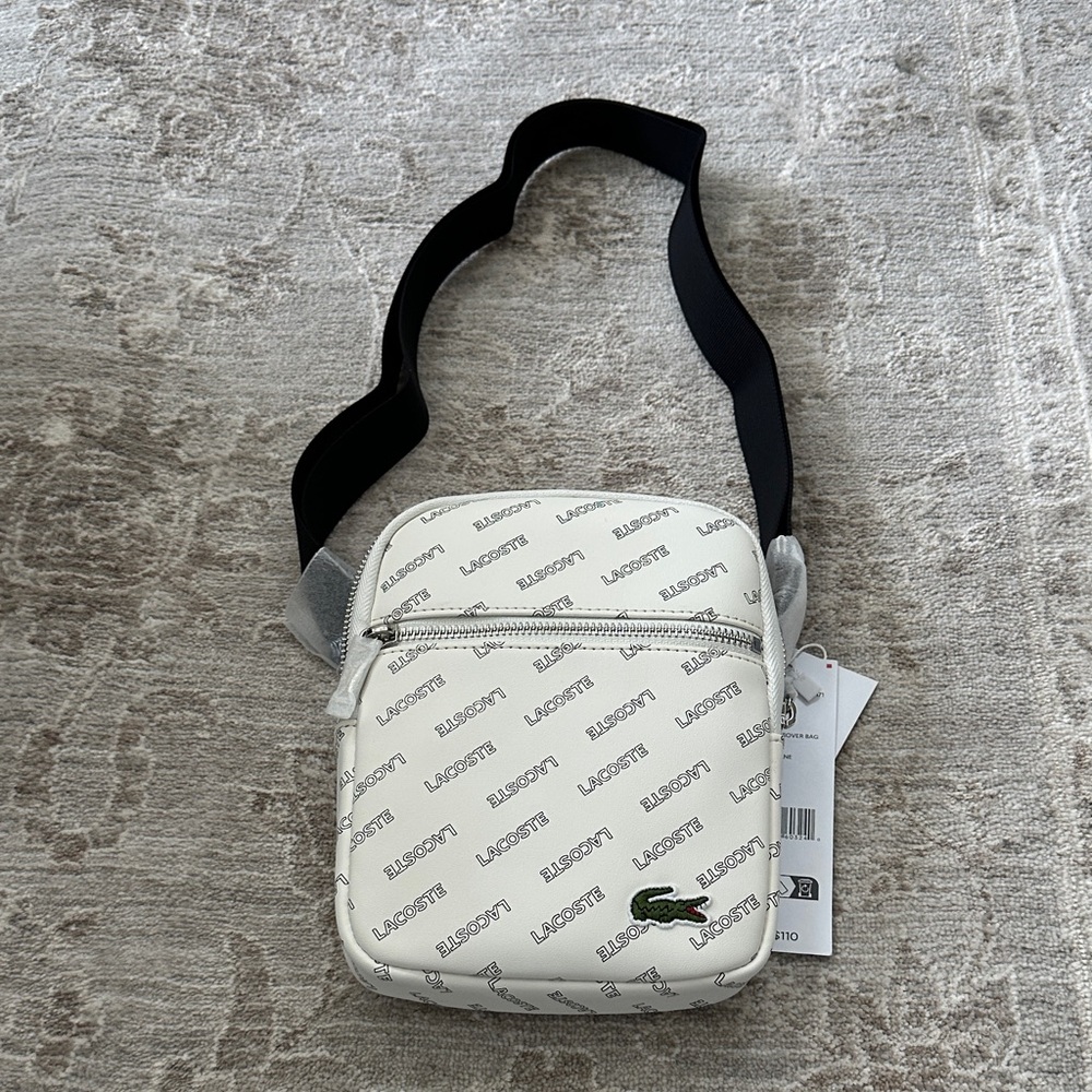 Lacoste White and Black Crossbody with adjustable strap. NWT’s.